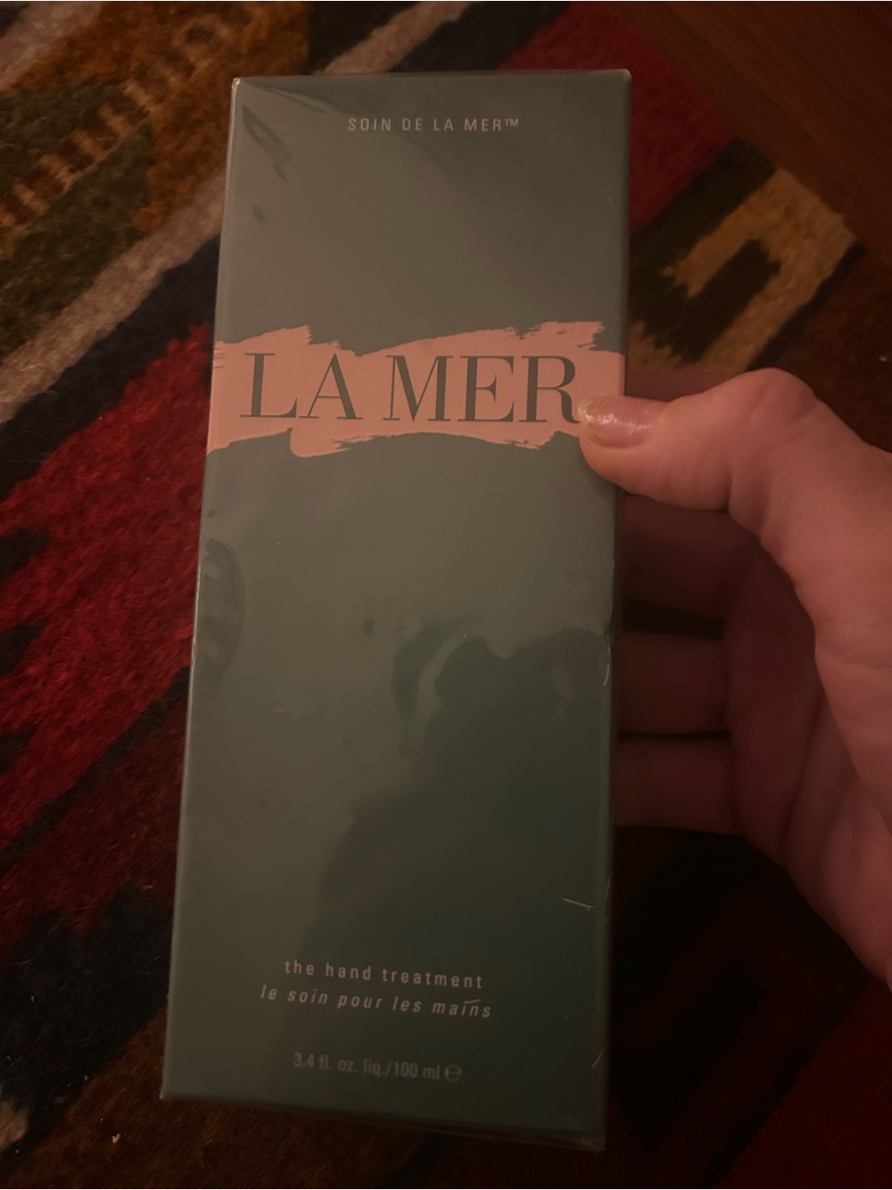 La Mer Body Lotion in Green and Pink Accents